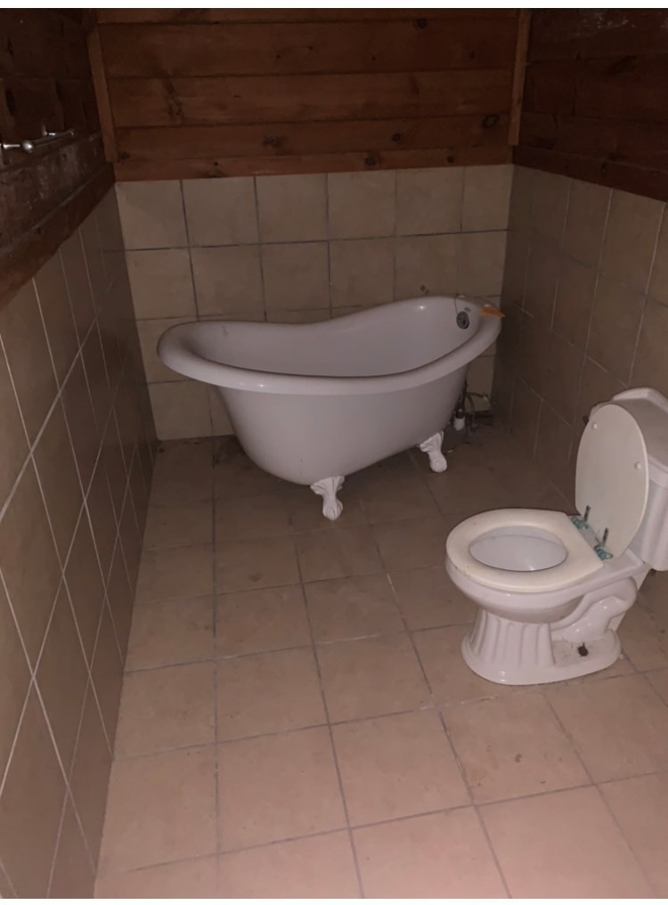 2557 Happy Hollow Road Sevierville, TN 37862 - Photo 3 of 17 a bathroom with a toilet and a shower