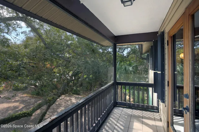 a view of a balcony with wooden floor