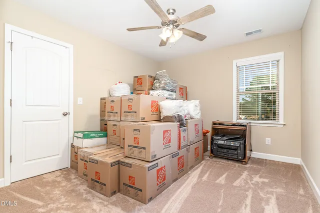 a bed room with furniture and a window