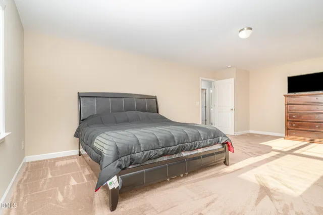 a bedroom with a bed and a walk in closet