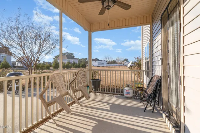 a view of a balcony with furniture