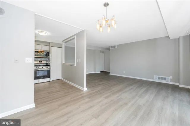 an empty room with wooden floor