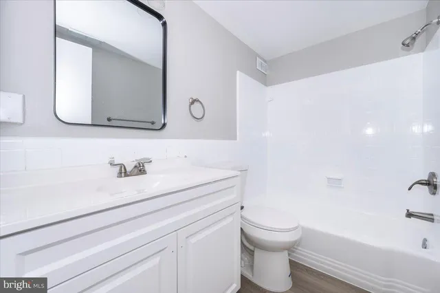 a bathroom with a sink a toilet and a bathtub