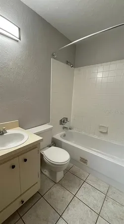 a bathroom with a sink toilet a mirror and shower
