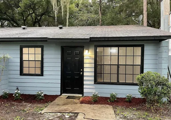 a view of house with outdoor space