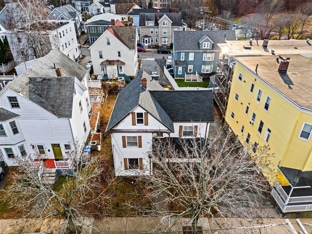 a aerial view of a house with parking space
