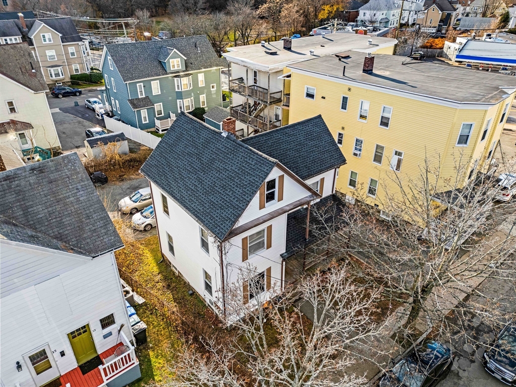 11 Derby Street Waltham, MA 02453 - Photo 16 of 23 an aerial view of a house with large trees