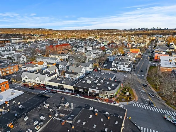 an aerial view of residential houses with outdoor space