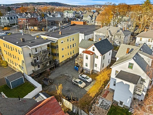 an aerial view of residential houses with outdoor space