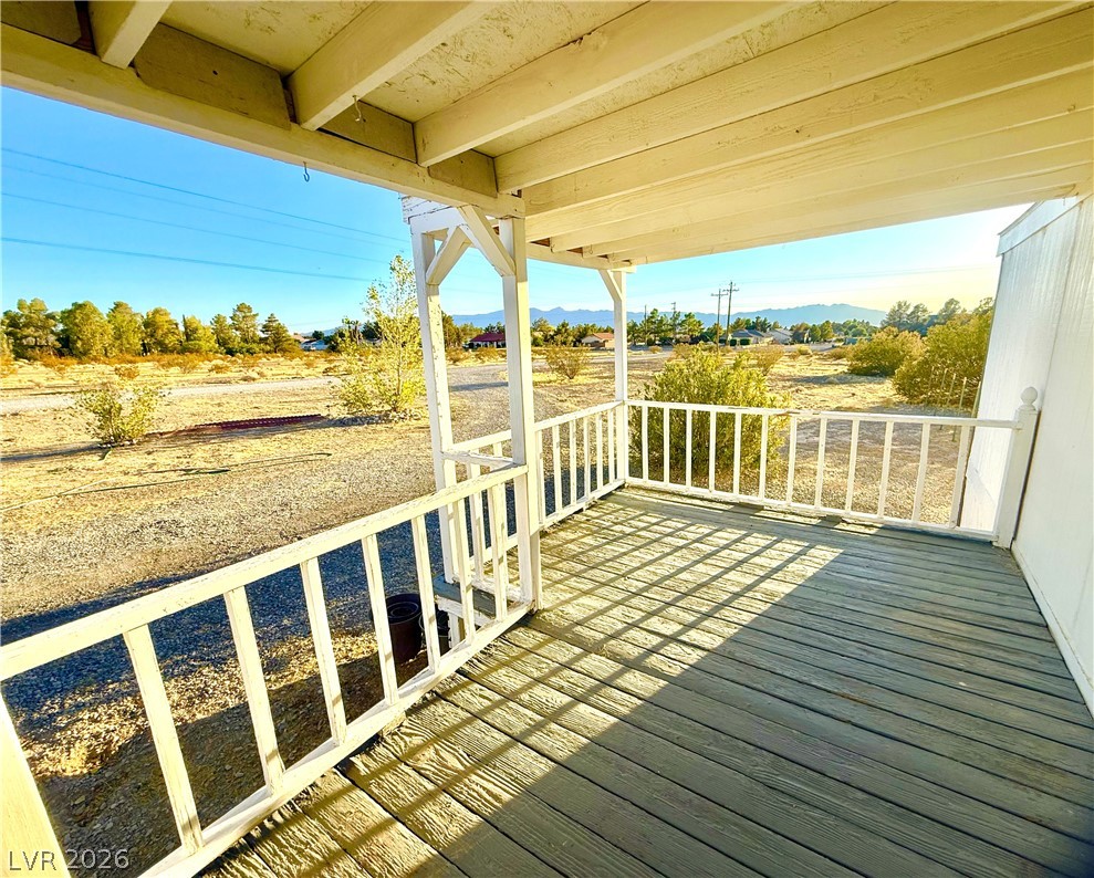 6471 Hafen Ranch Road Pahrump, NV 89061 - Photo 5 of 22 A welcoming front porch provides an ideal spot to survey the scenic landscape and mountain views.