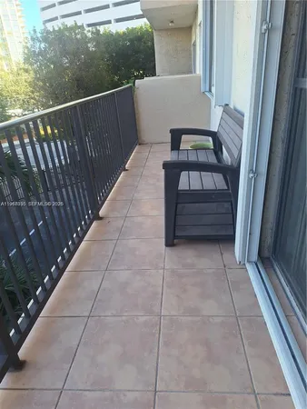 a view of a livingroom with bathroom and white walls