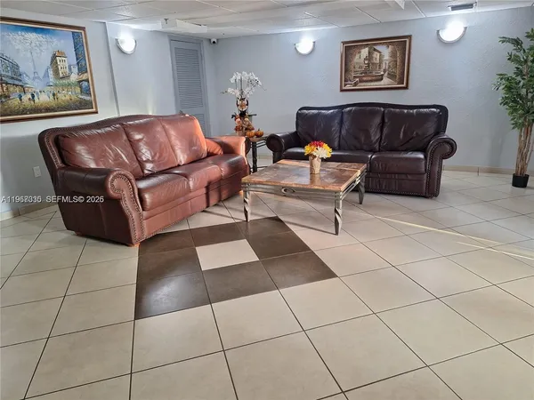 a view of a chairs and table in back yard of the house