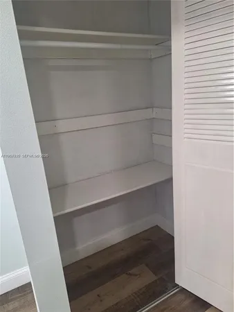 a kitchen with granite countertop a stove and a sink