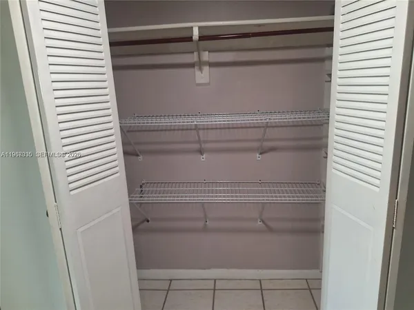 a stove top oven sitting inside of a kitchen