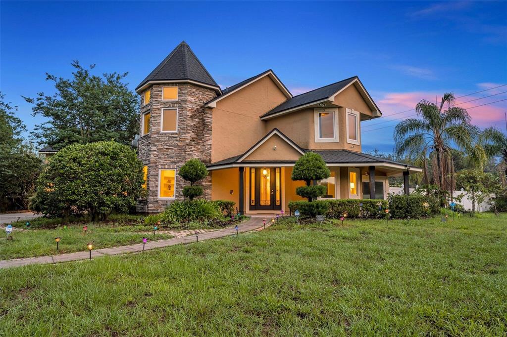 1415 Brumley Road Chuluota, FL 32766 - Photo 11 of 46 a front view of a house with a yard