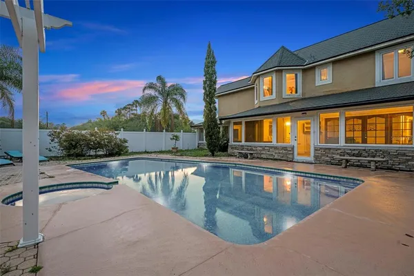 a view of a swimming pool with a patio