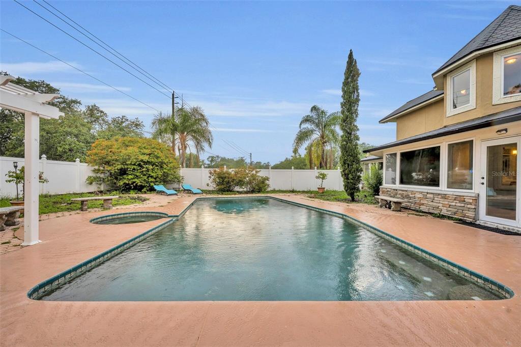 1415 Brumley Road Chuluota, FL 32766 - Photo 17 of 46 a swimming pool with outdoor seating and yard