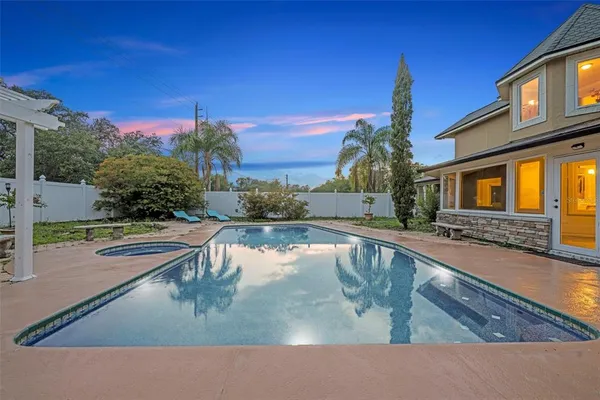 a view of a house with swimming pool
