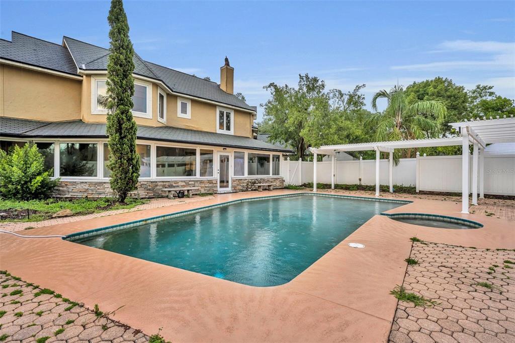 1415 Brumley Road Chuluota, FL 32766 - Photo 19 of 46 a view of a house with swimming pool