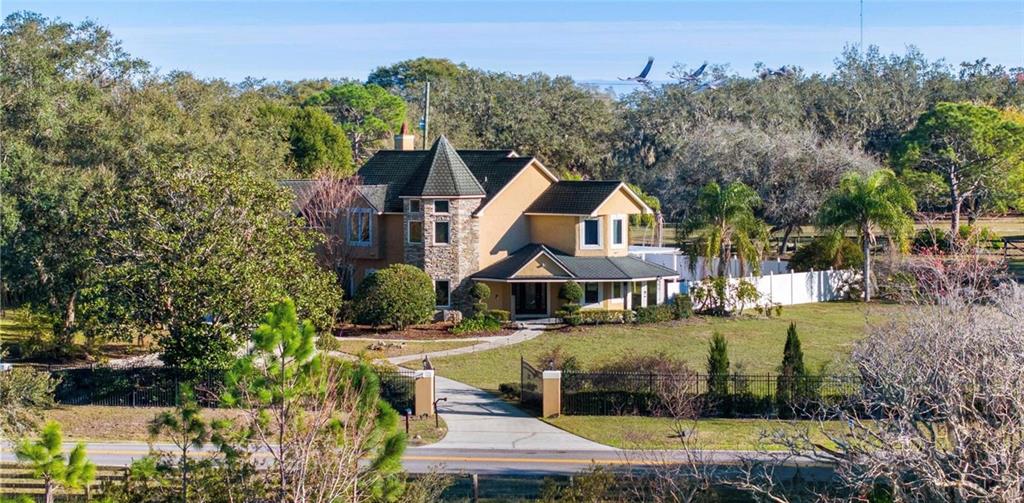 1415 Brumley Road Chuluota, FL 32766 - Photo 28 of 46 a view of a town with large trees and plants