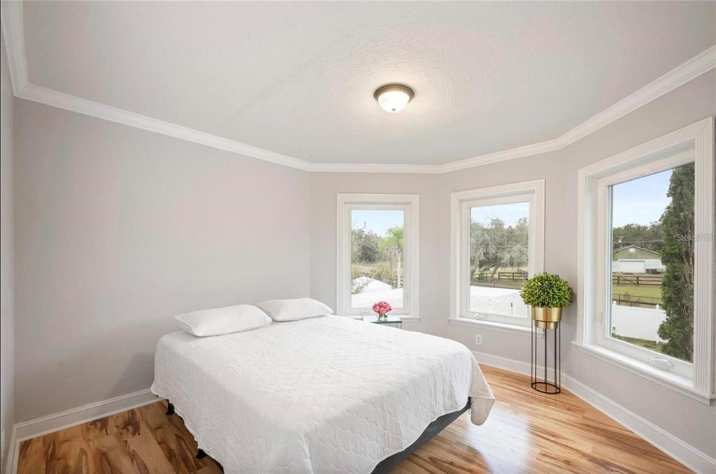 1415 Brumley Road Chuluota, FL 32766 - Photo 37 of 46 a bedroom with a bed and a large window