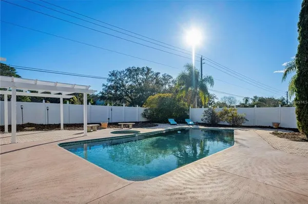 a view of a swimming pool with a patio
