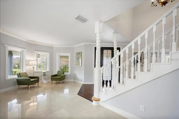 a living room with furniture and a window