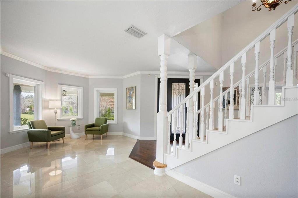 1415 Brumley Road Chuluota, FL 32766 - Photo 7 of 46 a living room with furniture and a flat screen tv