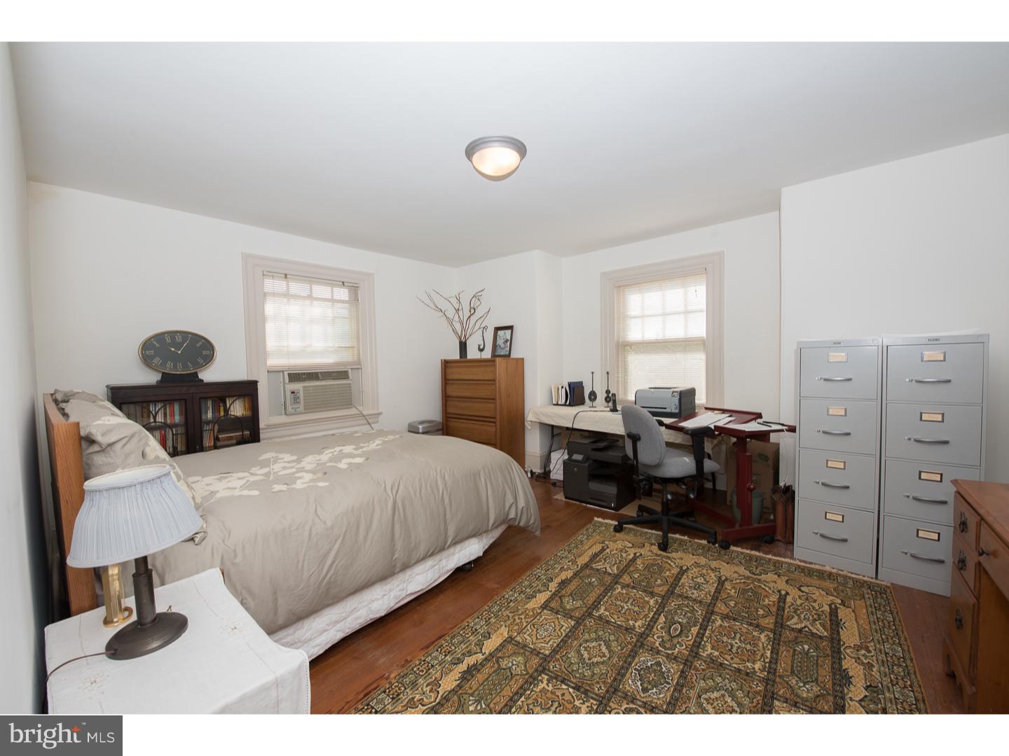 540 Manor Road Wynnewood, PA 19096 - Photo 17 of 25 a bedroom with a bed and a desk