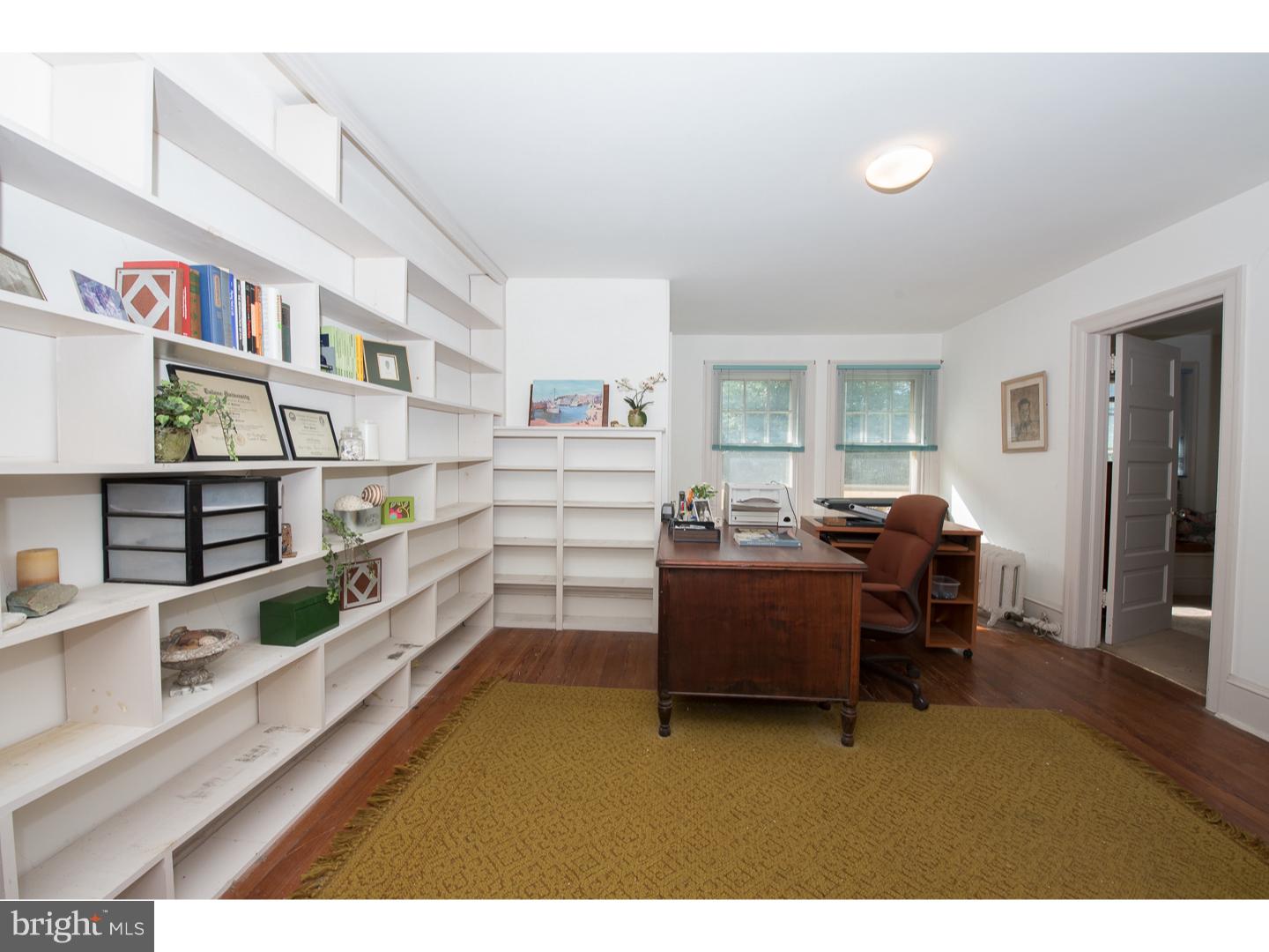 540 Manor Road Wynnewood, PA 19096 - Photo 18 of 25 a living room with furniture and a book shelf