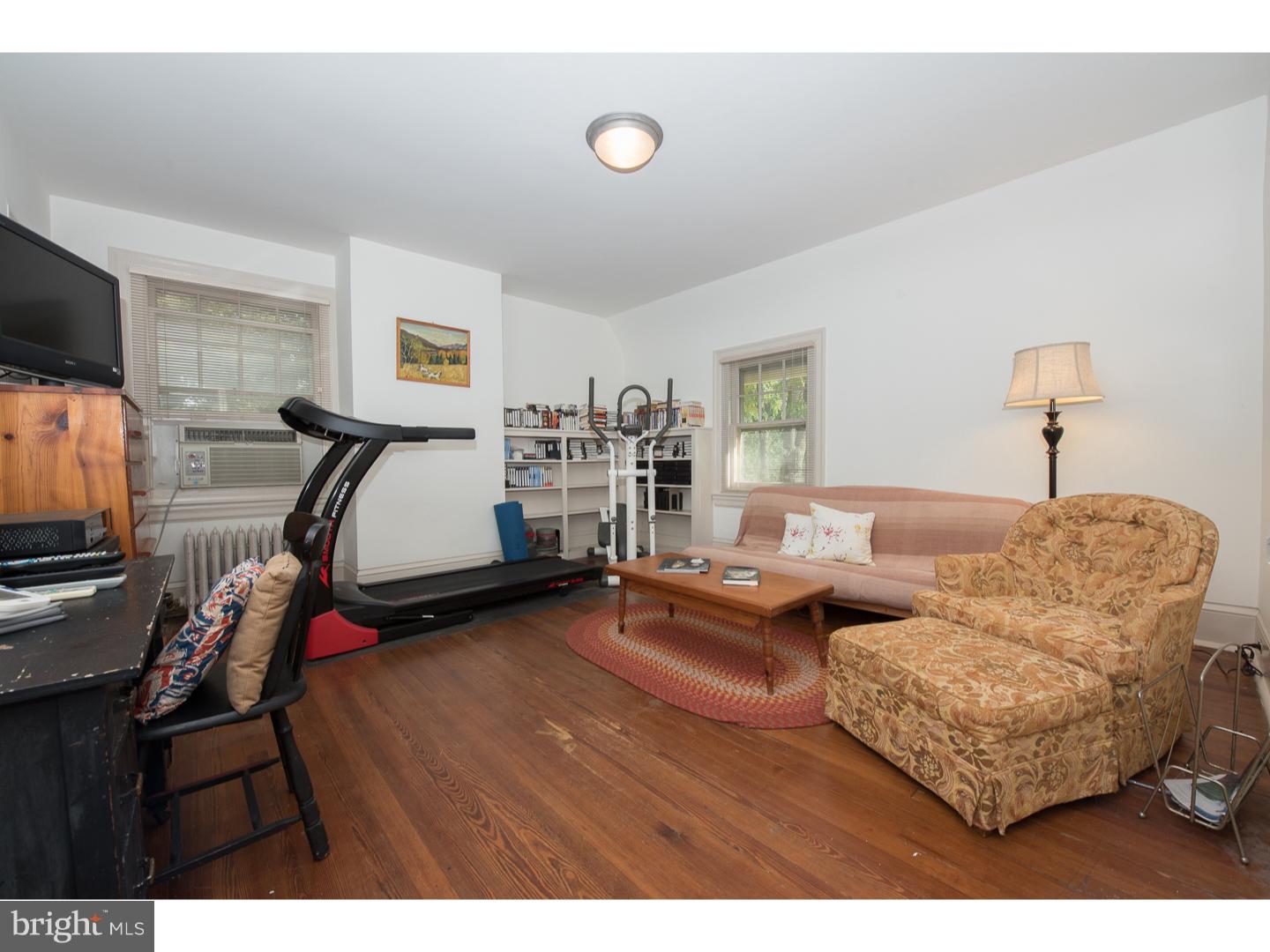 540 Manor Road Wynnewood, PA 19096 - Photo 21 of 25 a living room with furniture and a flat screen tv