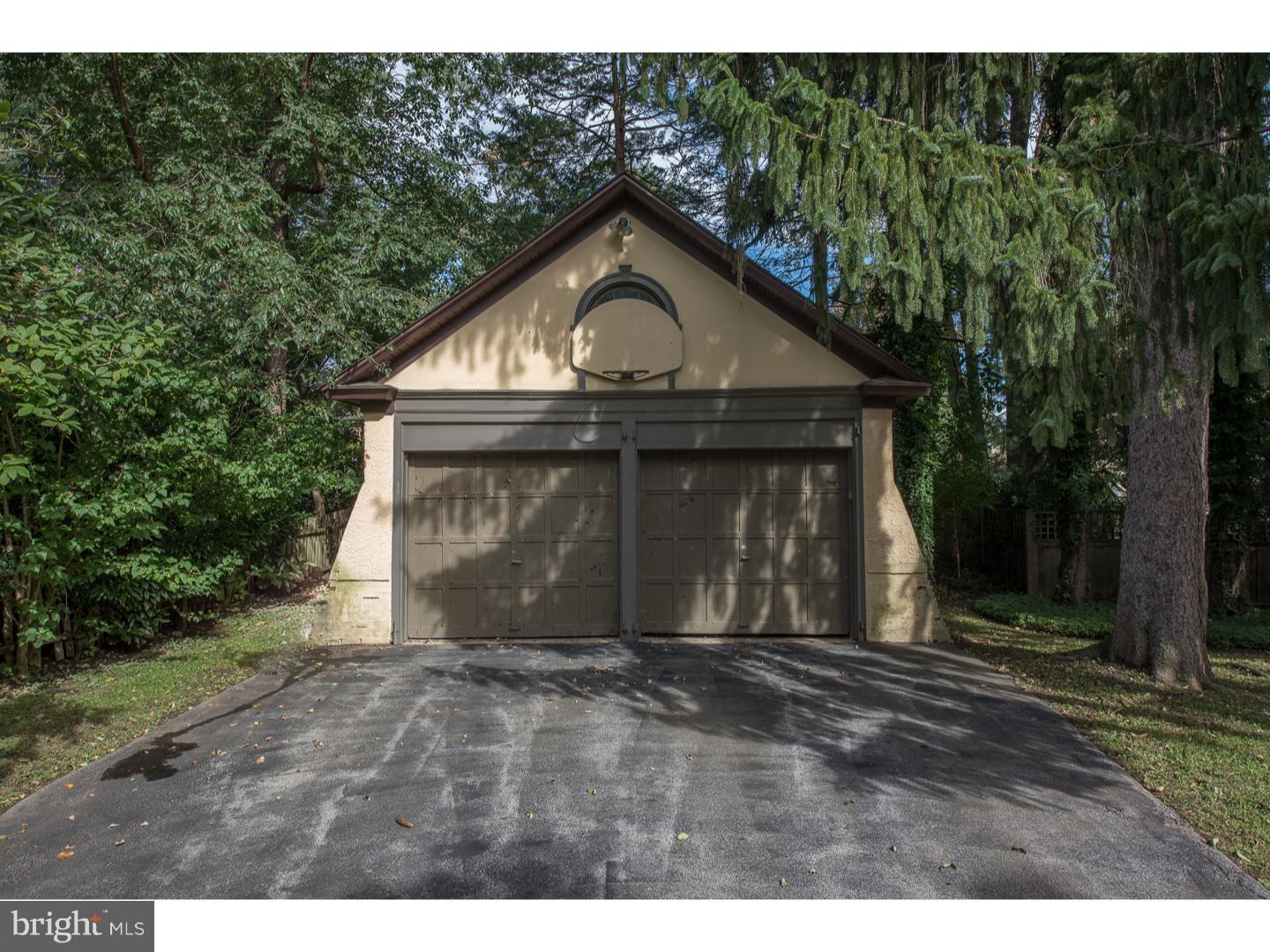 540 Manor Road Wynnewood, PA 19096 - Photo 24 of 25 a front view of a house with a yard and garage