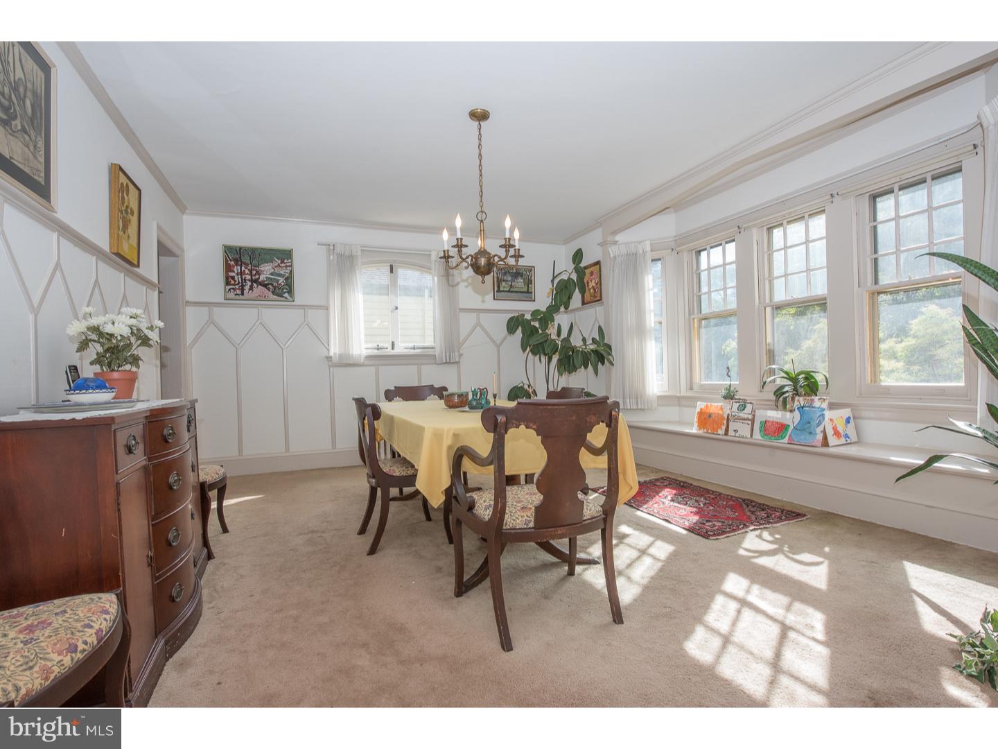 540 Manor Road Wynnewood, PA 19096 - Photo 8 of 25 a dining room with furniture a chandelier and wooden floor