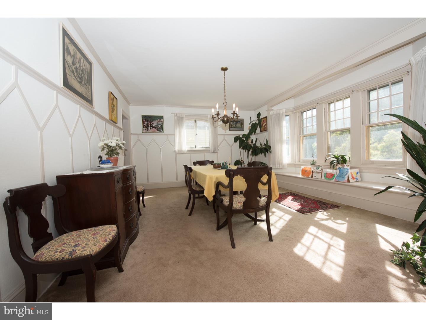 540 Manor Road Wynnewood, PA 19096 - Photo 9 of 25 a living room with furniture and a chandelier