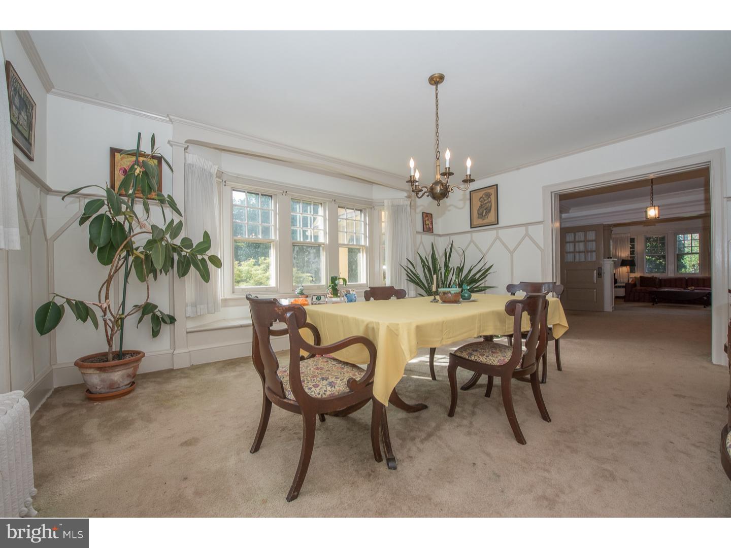 540 Manor Road Wynnewood, PA 19096 - Photo 10 of 25 a view of a dining room with furniture and a chandelier