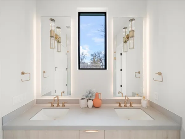 a bathroom with a tub sink and mirror
