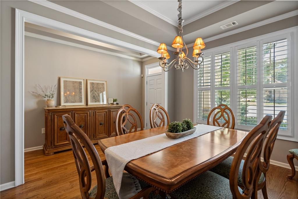 319 Laurel Lookout Hills Canton, GA 30114 - Photo 11 of 80 a view of a dining room and a table or chairs