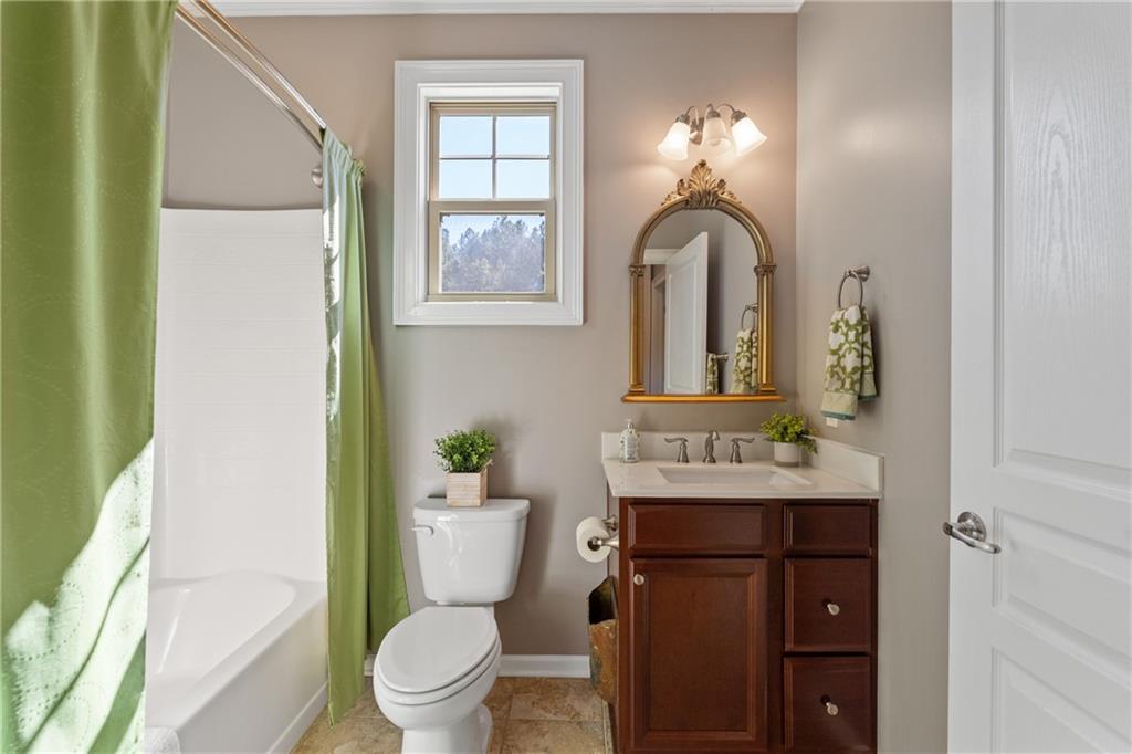 319 Laurel Lookout Hills Canton, GA 30114 - Photo 14 of 80 a bathroom with a toilet sink and mirror