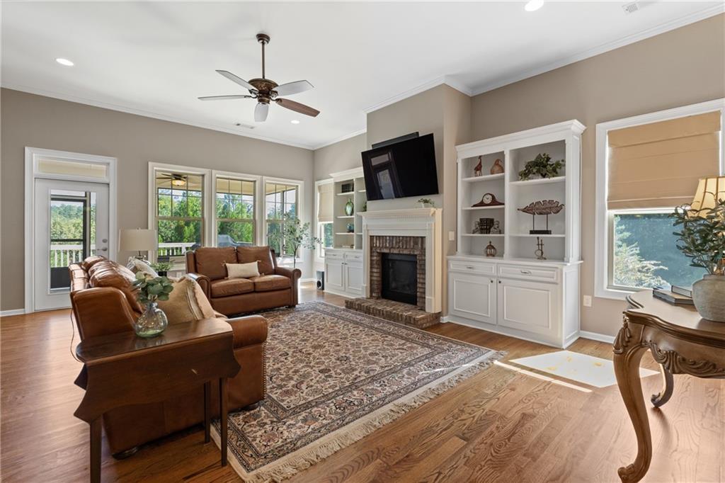319 Laurel Lookout Hills Canton, GA 30114 - Photo 15 of 80 a living room with furniture a fireplace and a flat screen tv