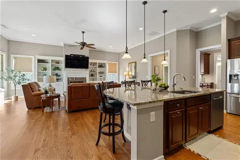 a view of a dining room with furniture and wooden floor