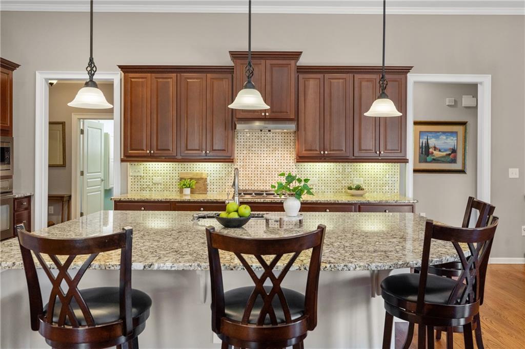 319 Laurel Lookout Hills Canton, GA 30114 - Photo 21 of 80 a kitchen with a dining table chairs and granite counter tops
