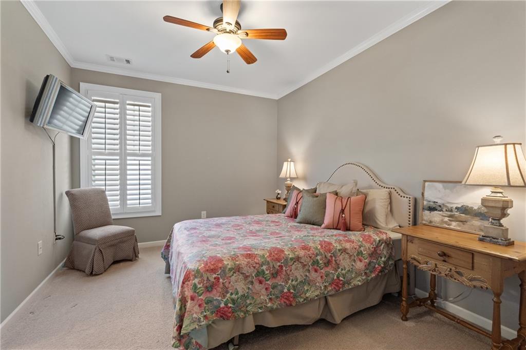 319 Laurel Lookout Hills Canton, GA 30114 - Photo 39 of 80 a bedroom with two beds and a chandelier