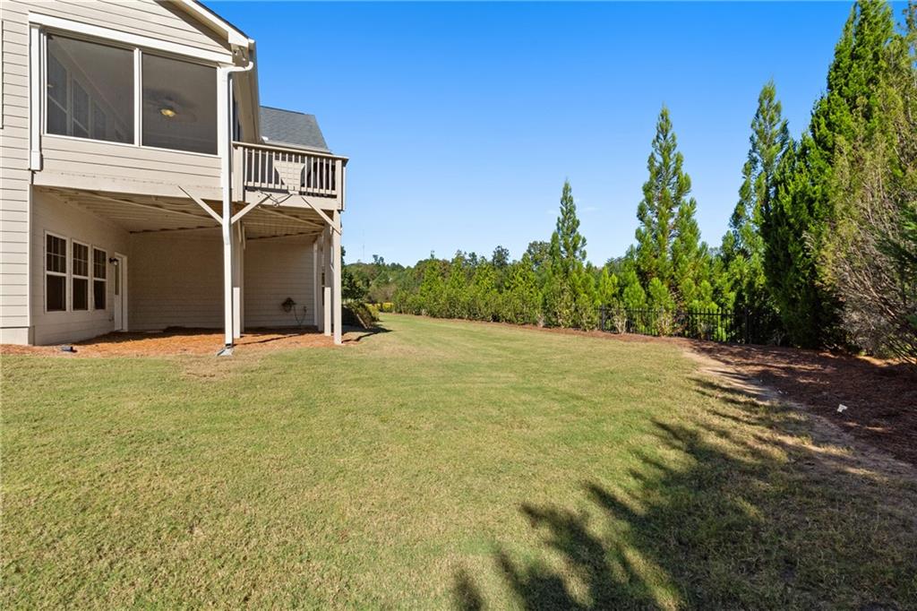 319 Laurel Lookout Hills Canton, GA 30114 - Photo 51 of 80 a view of a house with a yard