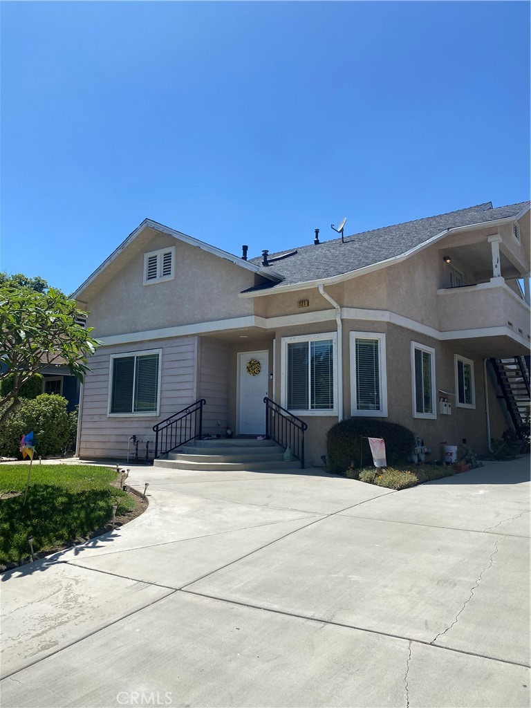 121 East Alhambra Road, Unit B Alhambra, CA 91801 - Photo 1 of 1 a front view of house with yard and trees in the background