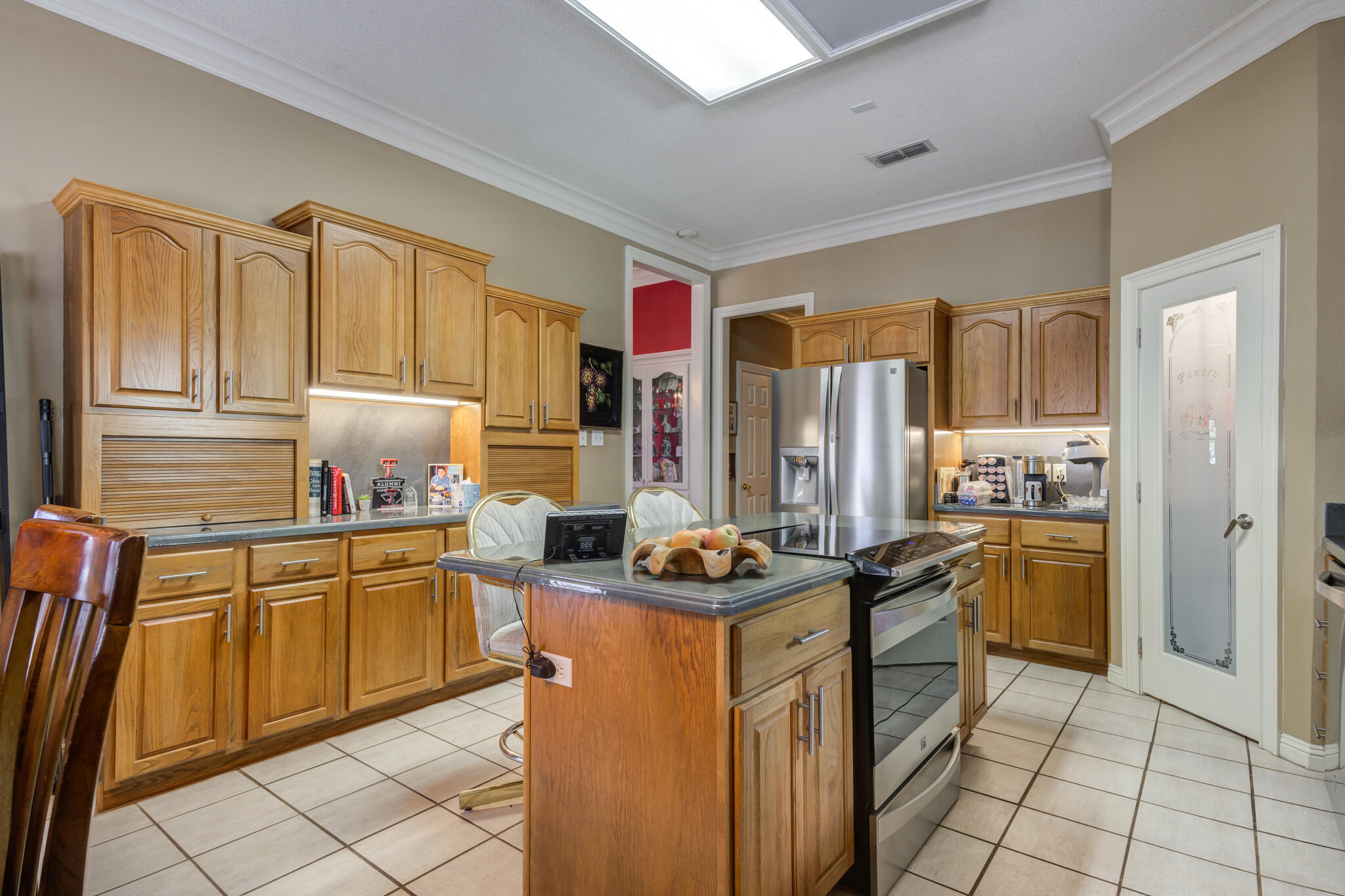 30 West Lakeshore Drive Ransom Canyon, TX 79366 - Photo 20 of 59 a kitchen with stainless steel appliances granite countertop a stove top oven a sink dishwasher and cabinets with wooden floor