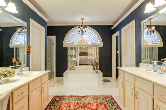 a bathroom with a bathtub and a window