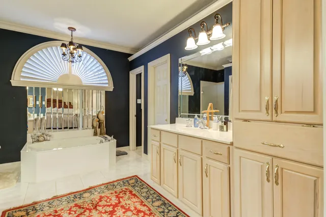 a kitchen with a refrigerator a stove top oven and a cabinets