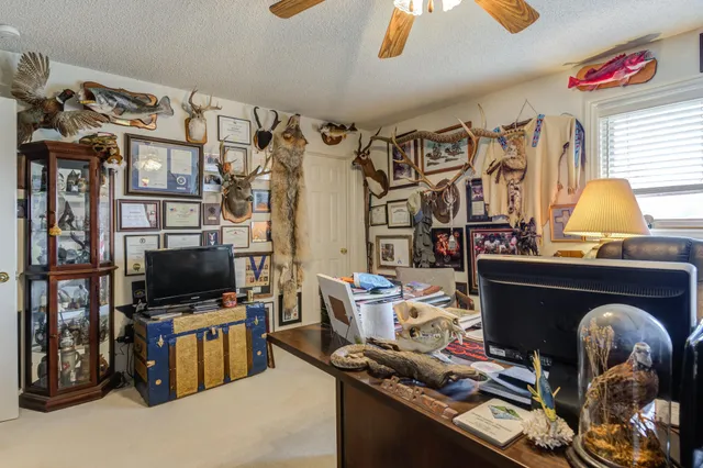 a front view of a house with outdoor seating