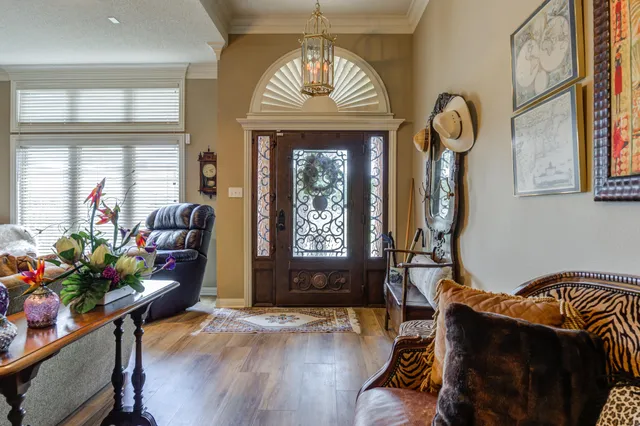 a view of a livingroom with furniture window and wooden floor