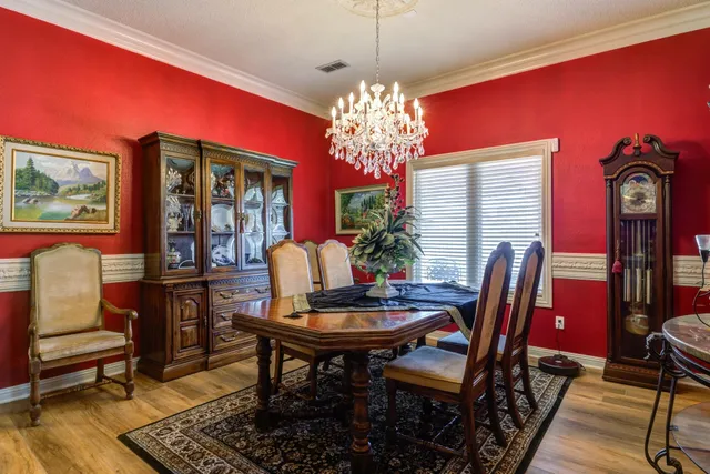 a view of a dining room with furniture and window